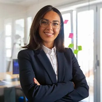 A woman in business attire standing