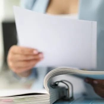 A woman holding a paper for a limited liability company