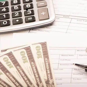 Dollar bills and calculator