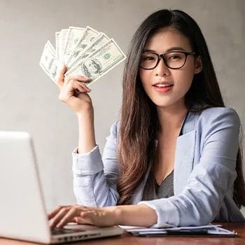 A woman holding a sum of money as expenses for starting a business