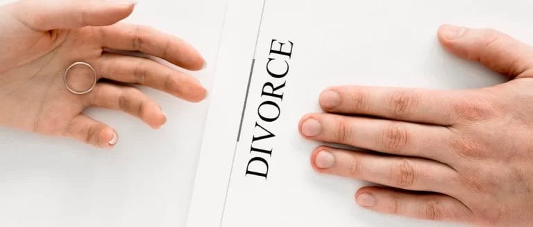 A person passing a divorce paper that will impact an LLC