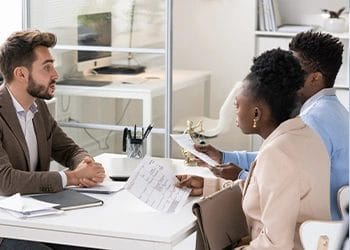 Three people having a meeting