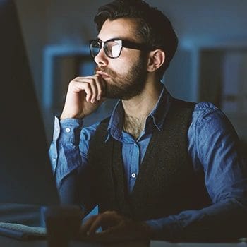 An LLC owner working late at night at the office