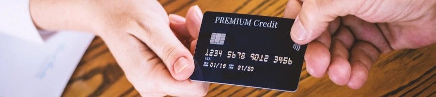 Close up shot of a business credit card held by LLC owners