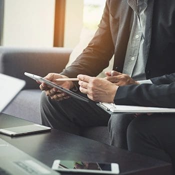 An LLC owner choosing an LLC manager from a tablet