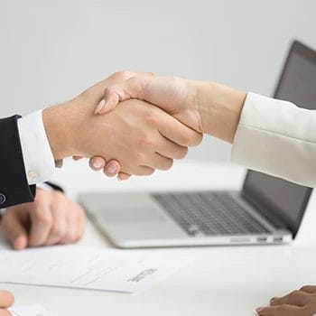 Two employees discussing the LLC operating agreement