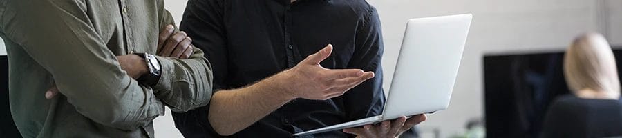 Two people discussing the advantages of working with a registered agent service