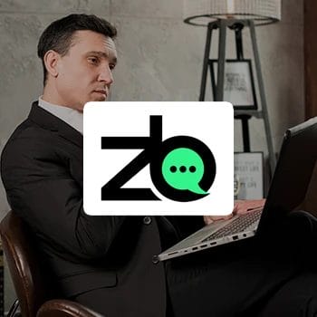 ZenBusiness logo with a background of a business man using a laptop