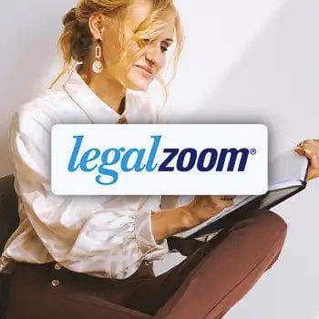 The LegalZoom logo with a business person in the background doing work
