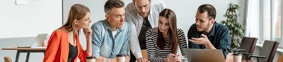 A group of people having a conversation about the advantages of working with a registered agent service in Oregon