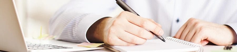 a man writing down the LLC formation services in Oklahoma