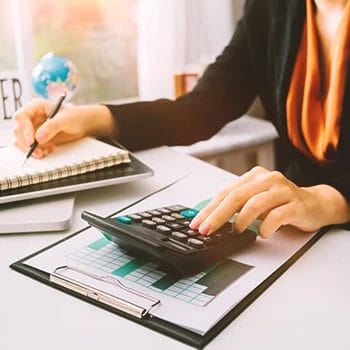 An office worker calculating the Mississippi local license fees