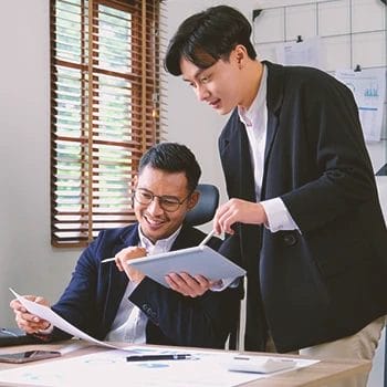 Two office workers having an operating agreement