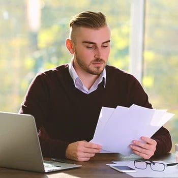 A company owner looking at a certificate of authority