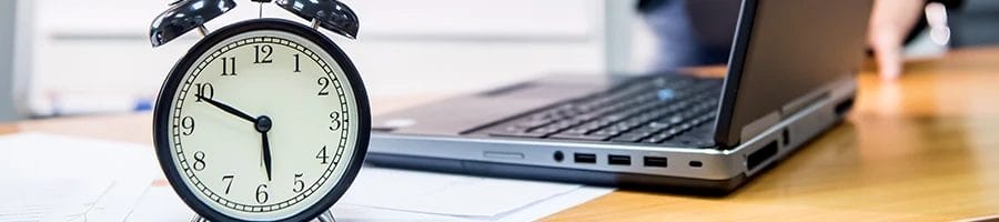 Clock and laptop